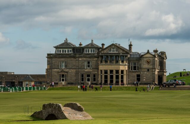 The R&A clubhouse and the Swilcan Bridge on the Old Course at St Andrews.