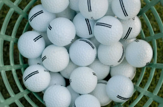 Basket of white golf balls