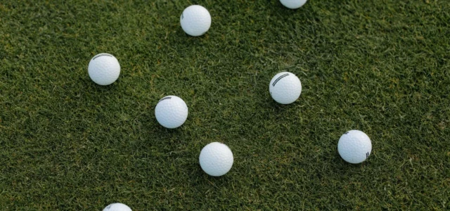Golf balls scattered in the grass